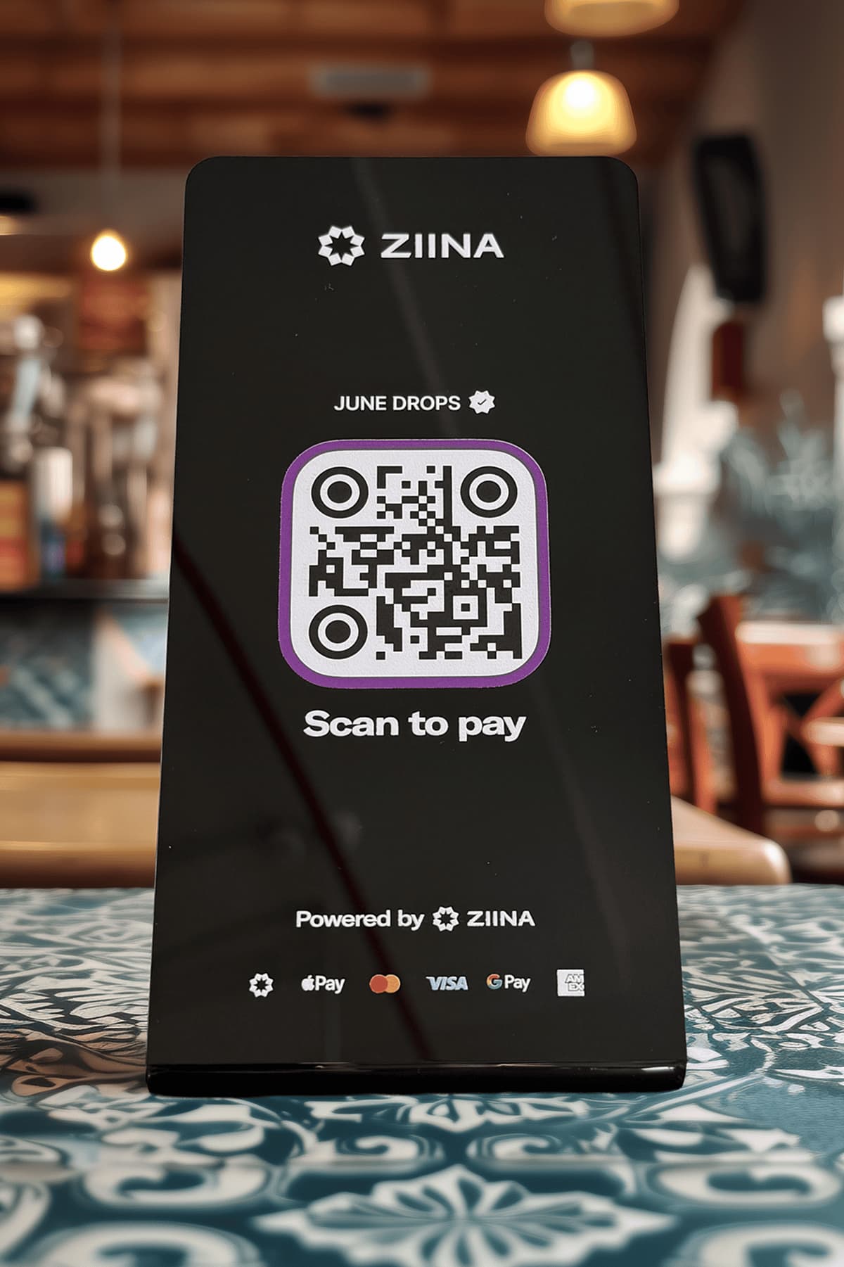 QR stand displayed on a shop counter